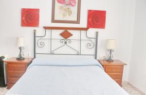 Posteľ alebo postele v izbe v ubytovaní Apartamento Trafalgar + 5 fotografií