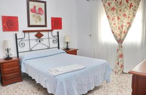 Posteľ alebo postele v izbe v ubytovaní Apartamento Trafalgar