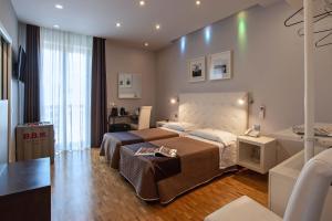 a hotel room with a bed and a television at Hotel Orcagna in Florence