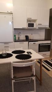 a kitchen with a counter top in a kitchen at Cozy Studio in Vantaa in Vantaa
