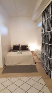 a bedroom with a large bed in a room at Cozy Studio in Vantaa in Vantaa