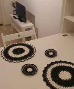 three black and white plates on a table at Cozy Studio in Vantaa in Vantaa