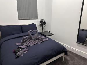 a bedroom with a bed with a towel on it at London Westminster nearby Zone1 in London