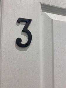 a number on a white wall with a number five at Central London- Zone 1 - Room 3 in London