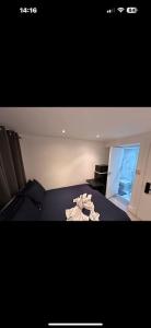 a picture of a bedroom with a bed and a window at London Eye 15 minutes away in London