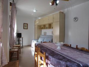 a living room with a couch and a table at CABO DE GATA HOME AND BEACH in El Cabo de Gata