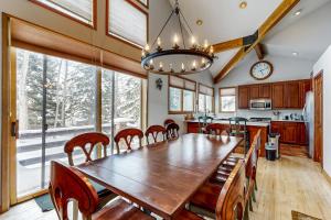 a dining room with a wooden table and chairs at All-Season Chalet in Park City