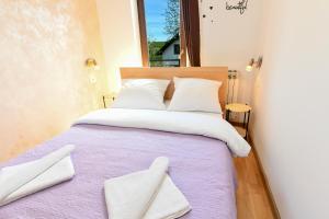Posteľ alebo postele v izbe v ubytovaní Apartments Patar
