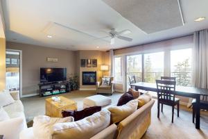 a large living room with a couch and a table at Cascade Bay Getaway in Eastsound