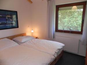 Postel nebo postele na pokoji v ubytování E19 Haus mit Wintergarten, Terrasse und Garten