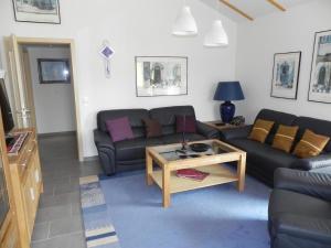 Posezení v ubytování E19 Haus mit Wintergarten, Terrasse und Garten + 14 fotografií