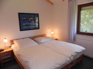 Postel nebo postele na pokoji v ubytování E19 Haus mit Wintergarten, Terrasse und Garten
