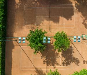 an overhead view of a street with traffic lights and trees at GHL Hotel Club el Puente in Girardot