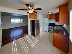 a kitchen with a ceiling fan and a refrigerator at San Jose Apartment in San Jose