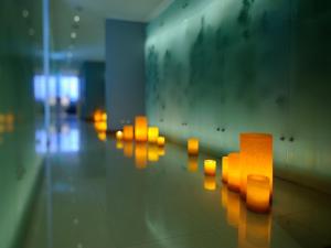 a row of orange lights on the floor in a room at NOI Vitacura in Santiago