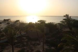 a view of the beach with the sun setting at Moyite Gandiol in Ndiébène