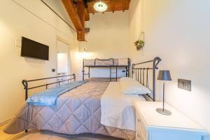 Agriturismo - La Campagna di San Francesco客房内的一张或多张床位