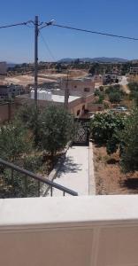 a view of a walkway in a city with buildings at Golden hotel in Jerash