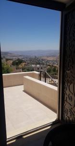 a view from the window of a balcony at Golden hotel in Jerash