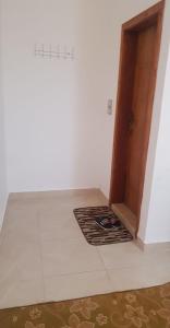 a room with a floor mat in front of a door at Golden hotel in Jerash