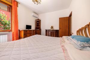 Ένα ή περισσότερα κρεβάτια σε δωμάτιο στο Luminoso appartamento +15 φωτογραφίες