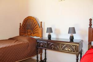 Ένα ή περισσότερα κρεβάτια σε δωμάτιο στο Vila Almeida