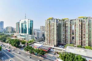 an aerial view of a city with tall buildings at Shanshui Trends Hotel Pazhou International Exhibition Center Branch in Guangzhou