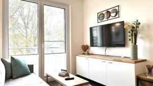 En TV eller et underholdningssystem på Apartment "Sonnendeck" - Haffresidenz
