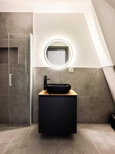 a bathroom with a sink and a mirror at SI-View Einzelzimmer Zimmer 25 in Siegen