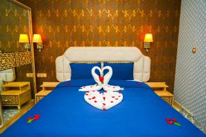 מיטה או מיטות בחדר ב-Great Holiday Apart-Hotel & Penthouse