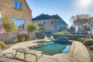 a swimming pool in the yard of a house at Riverfront North Augusta Home with Private Pool! in North Augusta
