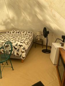 a bedroom with a bed in a tent at Snake River Glamping in Irwin