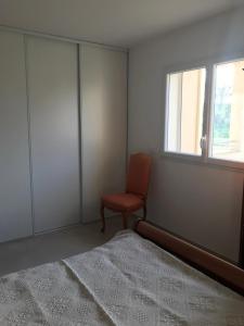 Ένα ή περισσότερα κρεβάτια σε δωμάτιο στο Appartement à Ghisonaccia-Prunelli