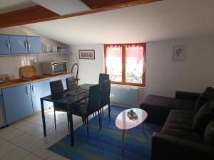 a living room with a couch and a table at Camping les Lavandes, Castellane in Castellane