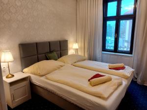 Postel nebo postele na pokoji v ubytování Hotel Jeleň
