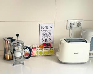 a kitchen counter with a toaster and a coffee maker at TOP APARTMENT frente a la Catedral in Pamplona
