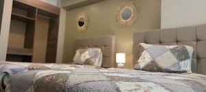 En eller flere senge i et værelse på Hostal Ñan Tika