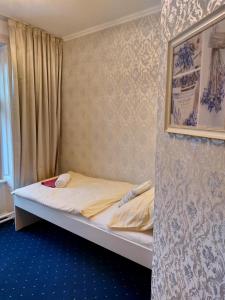 Postel nebo postele na pokoji v ubytování Hotel Jeleň