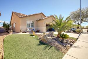 a house with a lawn in front of a house at Charming Henderson Home 6 Mi to Lake Las Vegas! in Las Vegas