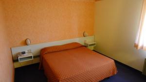 Llit o llits en una habitació de Hotel Grassetti