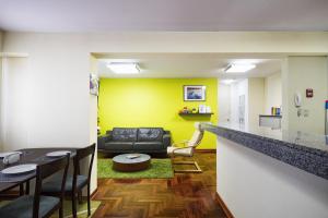 a living room with a couch and a table at La Masia Apartments in Lima