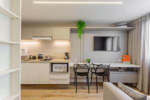 Kuchyň nebo kuchyňský kout v ubytování Easy Life Campus PUC by Xtay: Sua moradia em Curitiba