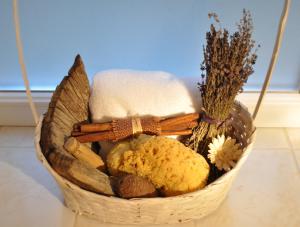 a basket filled with different types of food and flowers at Green Terrace Apartment Budapest in Budapest