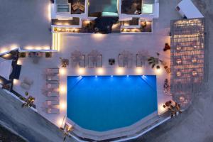 an overhead view of a swimming pool at night at Leon Luxury Suites in Imerovigli