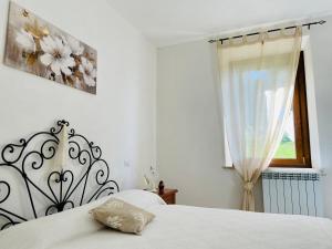 Postel nebo postele na pokoji v ubytování Podere Casagrande