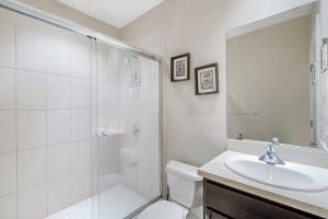 a bathroom with a shower and a toilet and a sink at 3BD Beauty in Coco - Have Coffee or Meals Overlooking Pool in Coco +20 photos