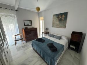 Кровать или кровати в номере Wonderful duplex in Calle Betis