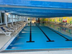 a swimming pool on a cruise ship at Appartamento Cinzia Residence Solaria Marilleva 1400 in Mezzana