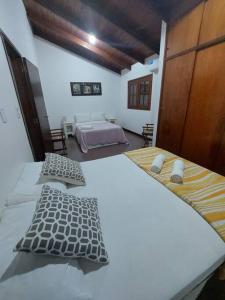Säng eller sängar i ett rum på Casa Paraíso Urutaú