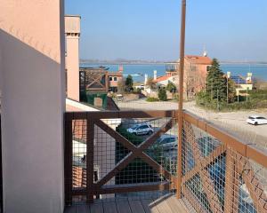 a balcony with a view of a parking lot at RosaMarina 227 in Cavallino-Treporti